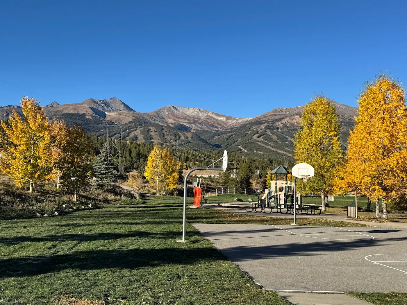 Golden aspens and homes in Breckenridge below the Tenmile Range